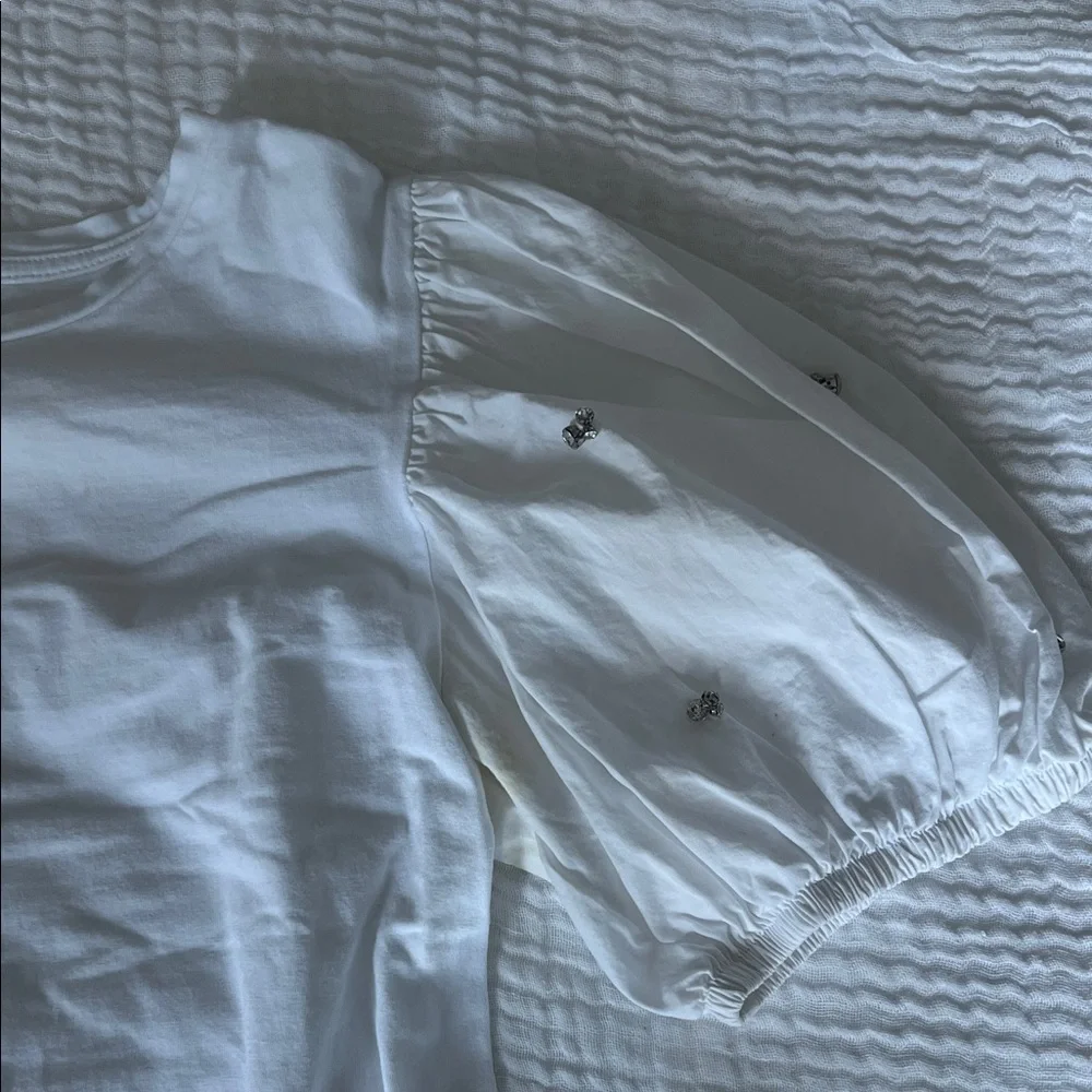White Zara blouse with puff sleeves and rhinestones
